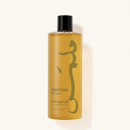 Malmas Sweet Almond & Honey Shower Oil 400ml bottle with a golden hue and a minimalist green design.