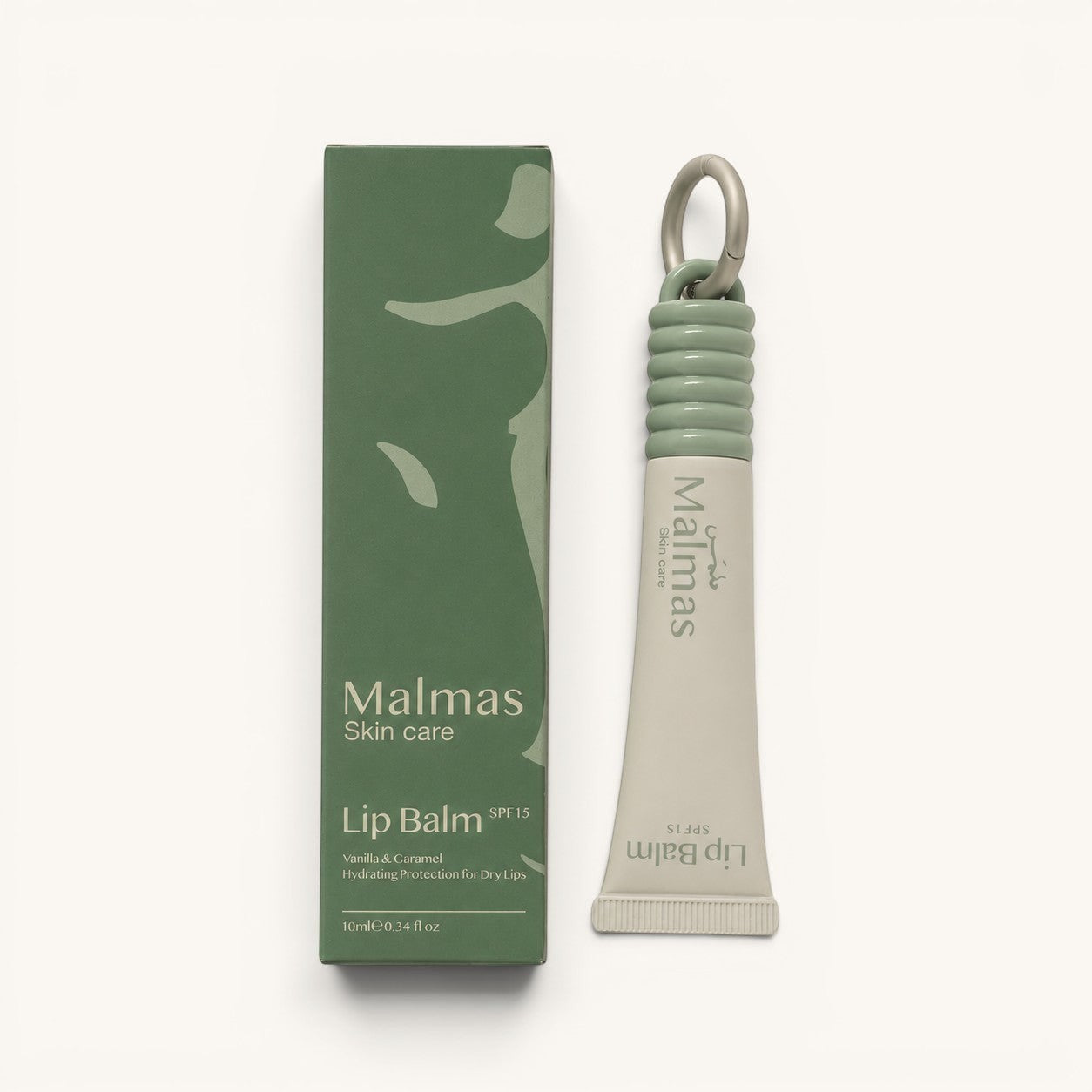 Malmas Skin Care Vanilla & Caramel Lip Balm SPF15 with a green ribbed cap and silver ring, 10ml tube.